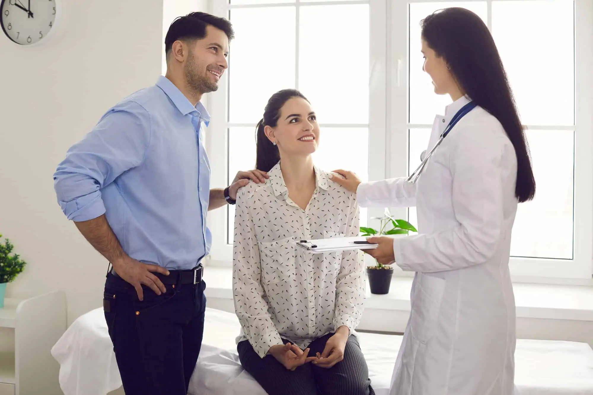 Couple consulting with doctor for sexual health care at Faith Family Health in Princeton, WV