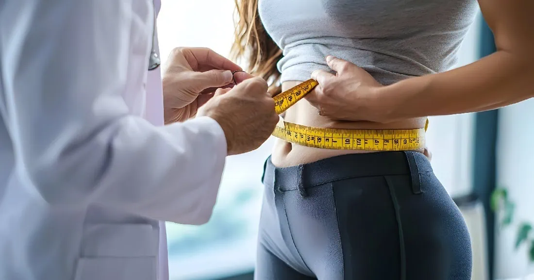 Doctor-measuring-womans-waist-with-tape-during-Medical-Weight-Loss-consultation-Blog-Post-in-Princeton-WV