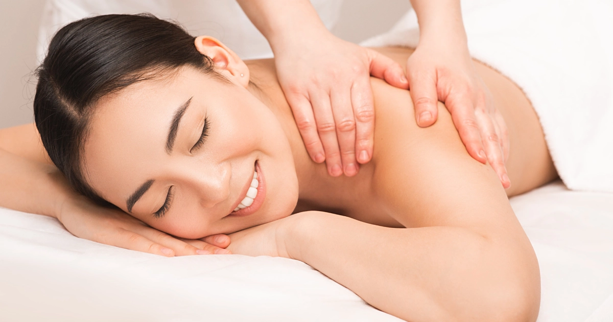 woman receiving a massage highlights the relaxation offered by Massage Services in Princeton, WV,